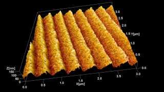 This is a topography image of a holographic, UV optimized, blazed diffraction grating with 2400 lines/mm. It is a good graphic illustration of how much further at the nanoscale Atomic Force Microscopy allows us to ‘see’ beyond what any optical device could. The ridges diffract visible and near-UV light. To light these ridges are perfectly flat. The AFM using a sharp BudgetSensors tip shows us that their surface is actually quite rough.