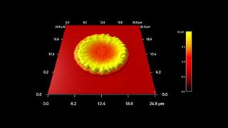 Silicon surface impacted with molten copper droplet from the exhaust of a spacecraft ion thruster